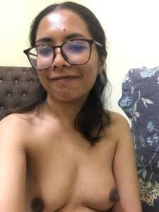 chasmish girl in glasses shows slim nude body and